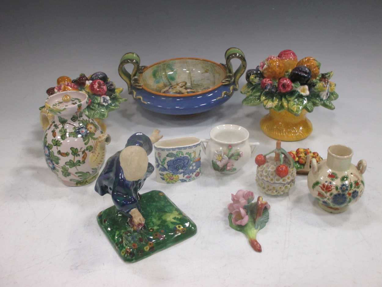 A Majolica style two handled bowl, decorated with a mother and her children, the handles modelled as