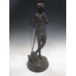A 20th century bronze of a boy with his dog, 62cm high