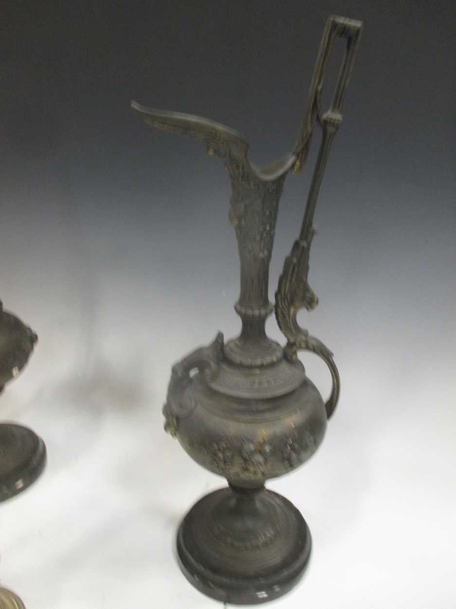 A pair of bronzed ewers together with a pair of brass cherub figures, 37cm high - Image 4 of 4