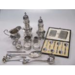 A collection of silverware including casters, napkin rings, cream jug flatware etc 25.5ozt gross