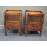A similar pair of George III mahogany tray top night cupboards with tambour fronts with pull out