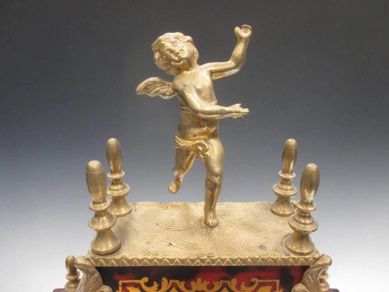 A Boulle mantel clock, surmounted by a cherub, 54cm high - Image 8 of 8