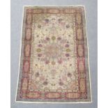 A signed Kashan rug, with central medallion within an ivory field, the signature believed to