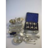 A quantity of silverware including flatware, a cream jug, bon bon dish, salt, clothes brush etc,