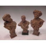 A pair of small terracotta busts of Ladies together with another by a different hand of a