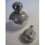 Two Victorian silver perfume bottles, one a dressing table variety with glass base, the other a