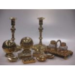 A collection of brass ware comprising a pair of 18th century brass table candlesticks of with