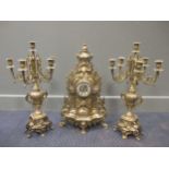 A heavy brass clock garniture, 60cm high (3)
