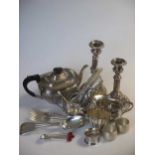 A quantity of silver plated wares including a pair of telescopic candlesticks, a three piece tea set