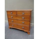 A late George III mahogany chest of two small and three long drawers with oval bail handles, old