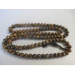 A long row of amber beads, length 170cm, weight 287.5g