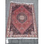 A Quashqai rug 155 x 104cm, a geometric rug 132 x 109cm another similar 138 x 102cm and a runner 315