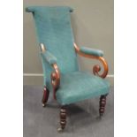 A William IV mahogany scroll arm armchair on turned legs and brass cup castors with teal coloured