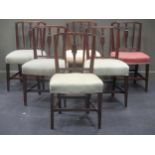 A set of six Regency style mahogany dining chairs, with canted top rails above a Prince of Wales