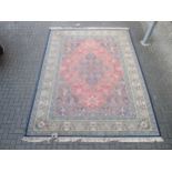 A 20th century Persian style rug 352 x 250cm, another similar 205 x 126cm and another Persian