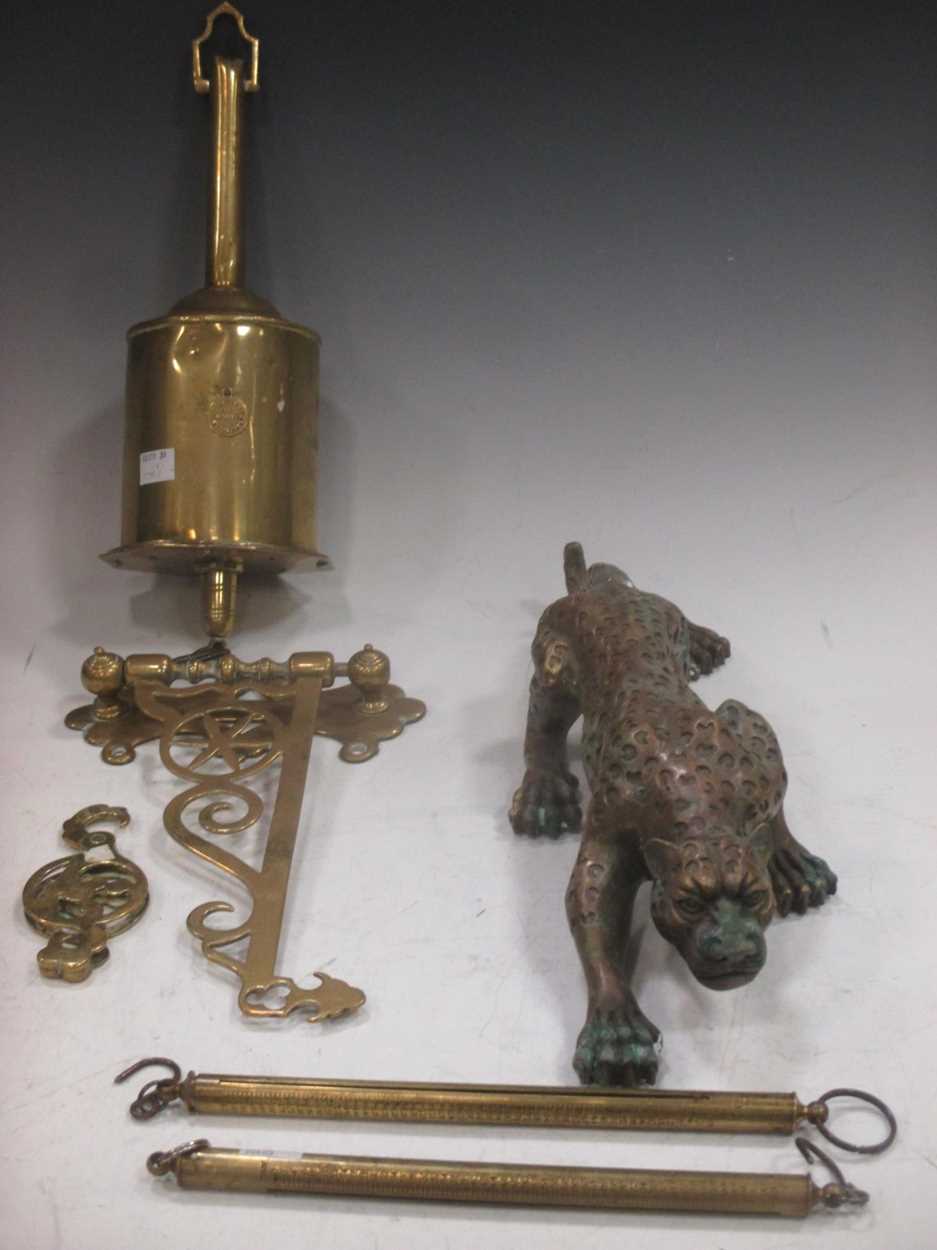 A Victorian brass spit jack, a brass leopard and other items