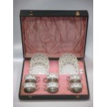 A crown Staffordshire set of six cabinet tea cups and saucers decorated with rosebuds, the cups with
