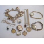 A collection of gold, including a charm bracelet, two half sovereigns, two gemset rings (one stone