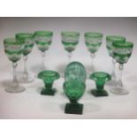 Collection of cut glassware: 7part green coloured wine glasses; 3 small green salts or vases;