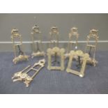 A set of six brass photograph stands, together with a pair of brass photograph frames (8)