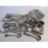 A collection of silver flatware together with 3 napkin rings, a watch holder a cigarette case and