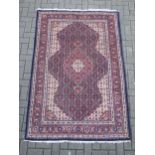 A Tabriz style rug 214 x 137cm