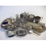 A collection of silver including sugar bowls, a waiter, condiment set, flatware, dressing table