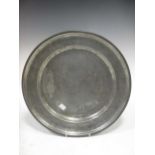 A pewter dish with incised decoration, bearing date '1691', 39cm diam