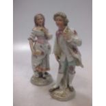 A pair of porcelain figures of a lady and gentleman, 21cm high