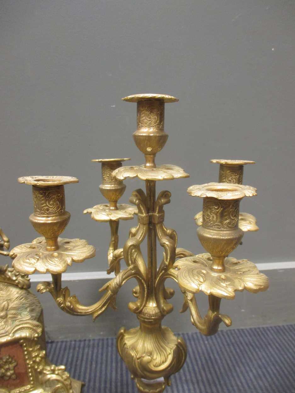 A brass clock garniture, the clock 41cm high, the candelabra 47cm high - Image 6 of 6