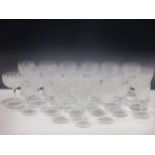 A part suite of Edwardian cut-glass wine glasses