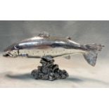 A modern and realistic silver model of a salmon,