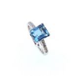 An 18ct gold aquamarine and diamond ring,