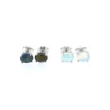 A pair of black opal and a pair of white opal ear studs,