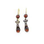 A pair of garnet ear pendants in the Edwardian style,