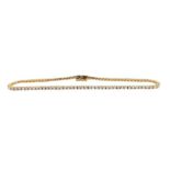 A slender diamond line bracelet,