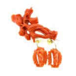 A 19th century carved coral brooch and ear pendants en suite,