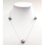 A long chain set with Tahitian pearls,