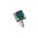 An emerald and diamond cluster ring,