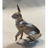 A 20th century cast silver model of a hare by A.E. Jones,