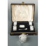 A George V silver Art Deco 5 piece condiment set in the original case,