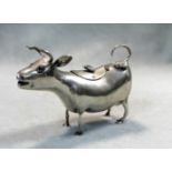 A Dutch metalwares silver Shuppe style cow creamer,