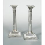 A pair of Edward VII silver candlesticks,