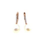 A pair of rose gold pearl and diamond ear pendants,