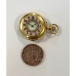 Unsigned - An unusual French 18ct gold lady's miniature half hunter pocket watch, retailed by J.W.