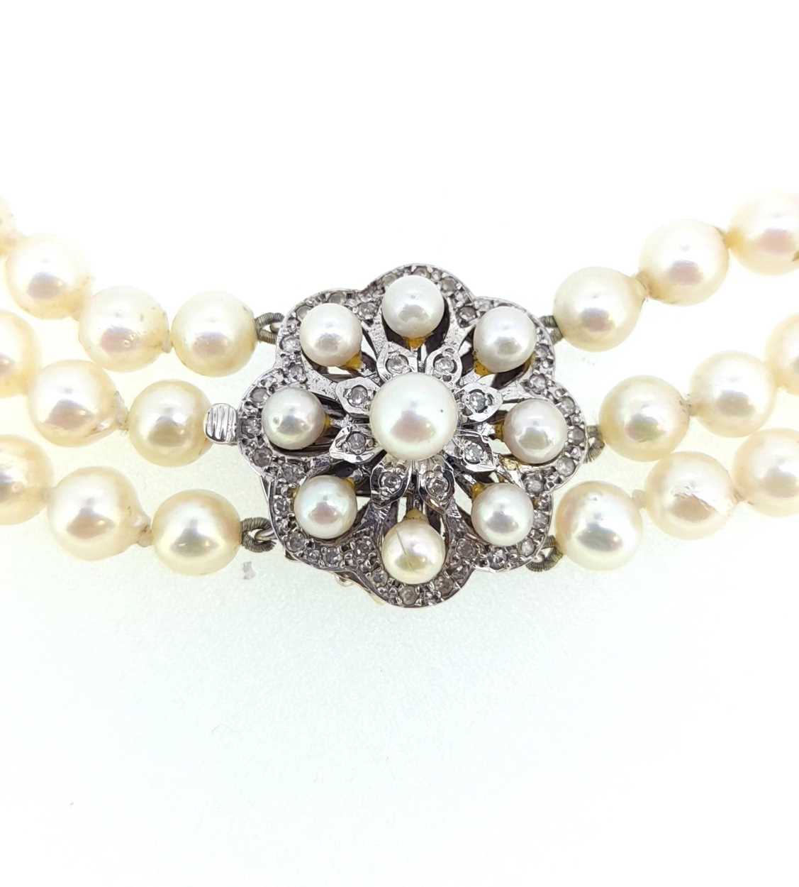 A three row pearl collar with a diamond set clasp, - Image 2 of 3