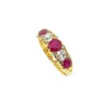 An 18ct gold ruby and diamond carved head ring,