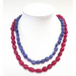 A necklace of carved rubies and sapphires,