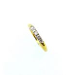 An 18ct gold ring set with five diamonds,