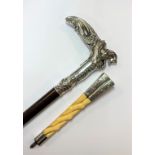 A late 19th century silver topped walking stick and parasol handle,